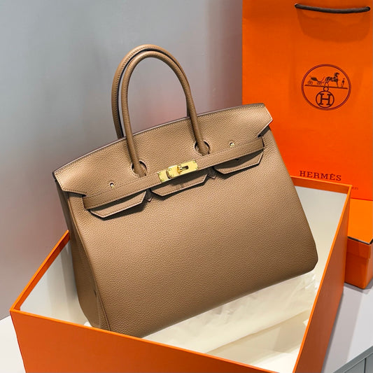 Chanel 25 Hobo bag grey coated canvas and antique gold-tone hardware + Hermès Birkin 25 handbag Beige Marfa Togo leather + Gucci Padlock small top handle bag embossed pink GG leather